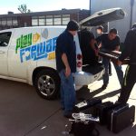 Students and staff from the Fair Play High School Music Department help Ruell unload the donated instruments and carry them inside.