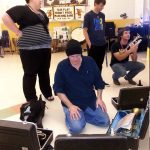 Ruell, staff and students and unpacking the instruments.