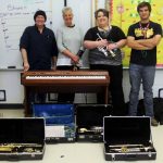 Here's Ruell and staff after the Fair Play Music Department received two saxes, two trumpets, a coronet, and a keyboard from Play It Forward SWMO